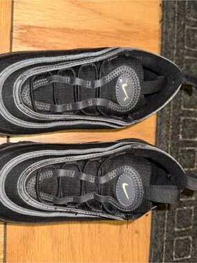 Nike Kids Black Sneakers with Reflective Silver Accents
